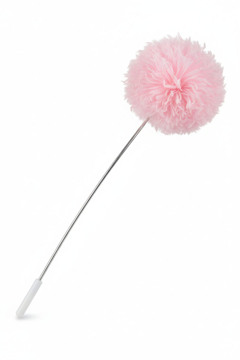 Pink fluffy pom pom cat wand teaser toy on white background