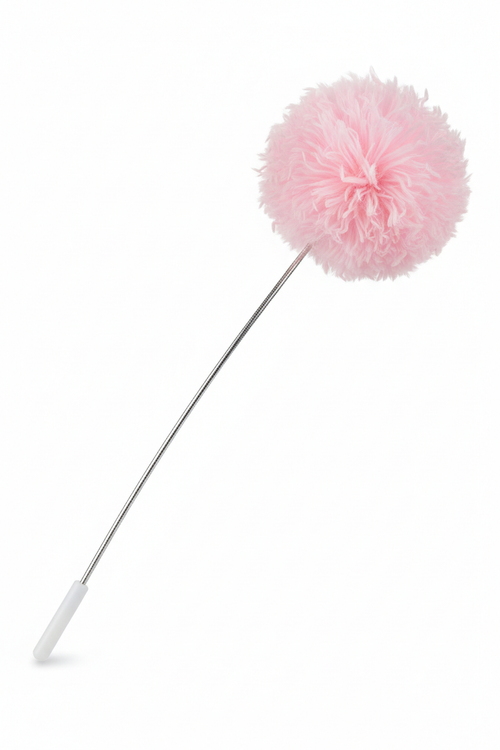 Pink fluffy pom pom cat wand teaser toy on white background