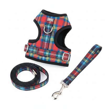 Colorful plaid dog harness and leash set flat lay on white background